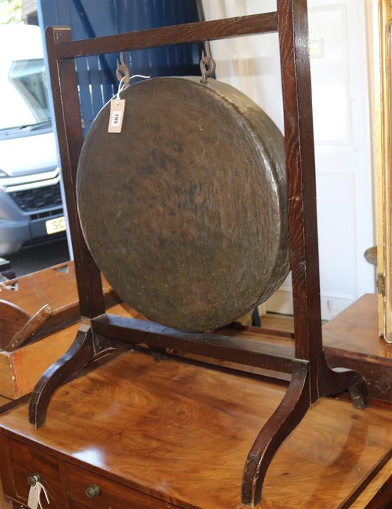 A dinner gong and stand W.63cm